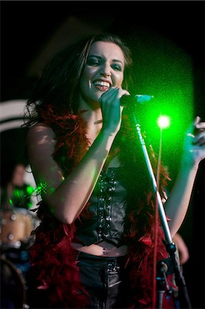 female musicians with long hair - Young female singing on stage in nightclub Stock Photo - Premium Royalty-Free, Code: 649-07063896