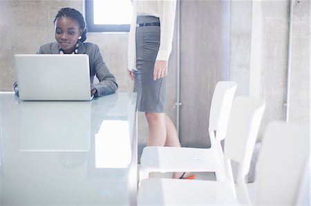 simsearch:614-07031408,k - Two young women in boardroom Stock Photo - Premium Royalty-Free, Code: 649-07063910