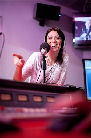 radio - Mid adult woman broadcasting in recording studio Stock Photo - Premium Royalty-Free, Code: 649-07063944