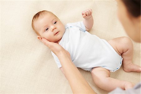 simsearch:649-07118168,k - Mother touching baby boy's cheek Foto de stock - Sin royalties Premium, Código: 649-07118162