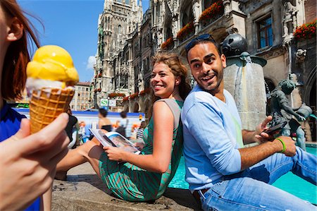 smile woman urban europe - Couple and woman with ice cream, Munich Marienplatz, Munich, Germany Stock Photo - Premium Royalty-Free, Code: 649-07118251