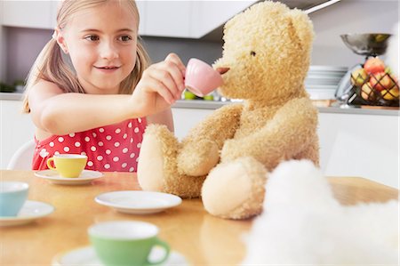 pictures of girls and teddy bears - Girl having tea party with soft toys Stock Photo - Premium Royalty-Free, Code: 649-07118298