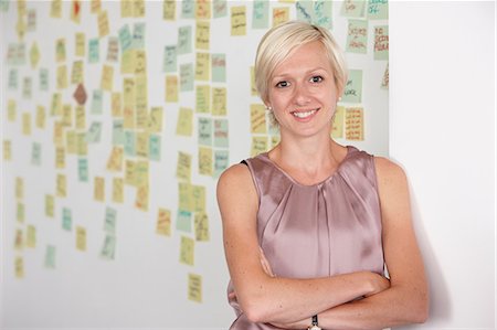 people at creative office - Portrait of mid adult woman with adhesive notes in background Stock Photo - Premium Royalty-Free, Code: 649-07118373