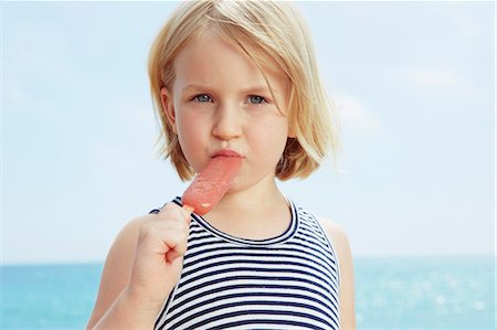 portrait of girl - Child eating ice lolly Stock Photo - Premium Royalty-Free, Code: 649-07118487