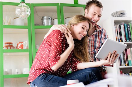 female computer laughing - Couple on video chat using digital tablet Stock Photo - Premium Royalty-Free, Code: 649-07118545