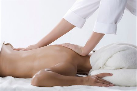 female health spa - Person massaging woman's back Stock Photo - Premium Royalty-Free, Code: 649-07118671