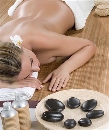 spa tranquility - Woman having hot stone therapy Stock Photo - Premium Royalty-Free, Code: 649-07118682