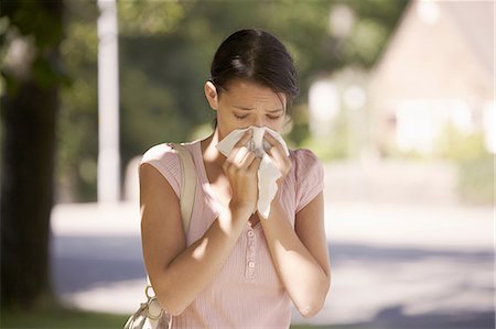 someone about to sneeze - Woman suffering from hay fever Stock Photo - Premium Royalty-Free, Code: 649-07118715