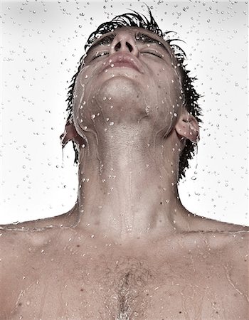 Young man showering Stock Photo - Premium Royalty-Free, Code: 649-07118739