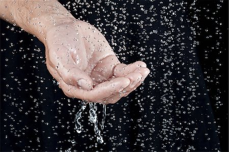 drip man - Hand catching water droplets Stock Photo - Premium Royalty-Free, Code: 649-07118741