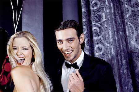 people in a party laughing - Young couple having fun in nightclub Stock Photo - Premium Royalty-Free, Code: 649-07118889