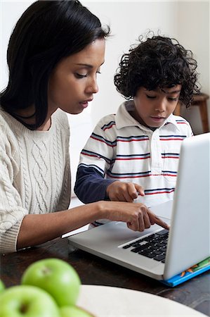 Mother and son using laptop Stock Photo - Premium Royalty-Free, Code: 649-07118927