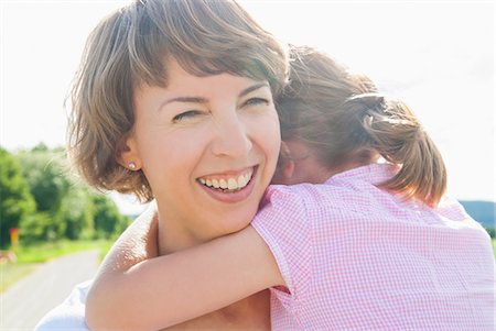 Mother holding daughter, smiling Stock Photo - Premium Royalty-Free, Code: 649-07118984