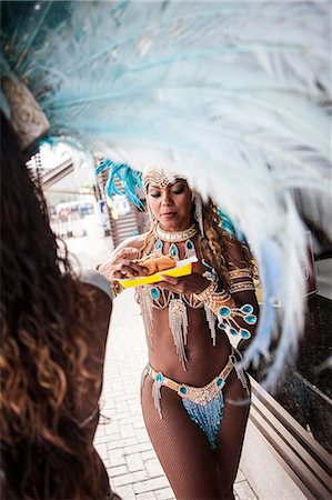 food stall - Samba dancers having hot dogs, Rio De Janeiro, Brazil Stock Photo - Premium Royalty-Free, Code: 649-07119519