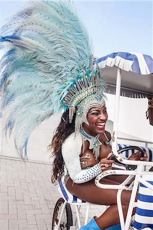 Samba dancer riding cart, Rio De Janeiro, Brazil Stock Photo - Premium Royalty-Free, Code: 649-07119533