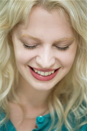 embarrassed female - Young woman with eyes closed Stock Photo - Premium Royalty-Free, Code: 649-07238239