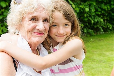 Portrait of grandmother and granddaughter hugging Stock Photo - Premium Royalty-Free, Code: 649-07238627
