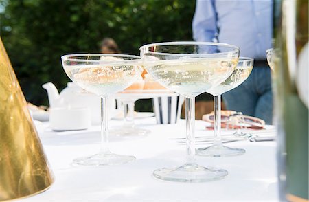 summer party wine - Champagne glasses on table, close up Stock Photo - Premium Royalty-Free, Code: 649-07238651