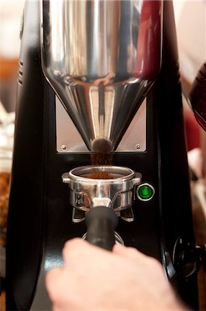 simsearch:649-07238688,k - Barista collecting ground coffee Stock Photo - Premium Royalty-Free, Code: 649-07238687