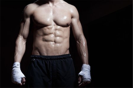 excercise black background - Muscular torso of boxer Stock Photo - Premium Royalty-Free, Code: 649-07238776