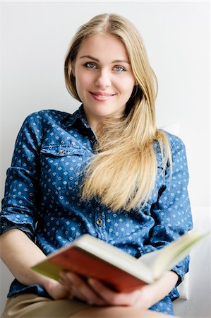 student female - Girl looking up from book Stock Photo - Premium Royalty-Free, Code: 649-07238837