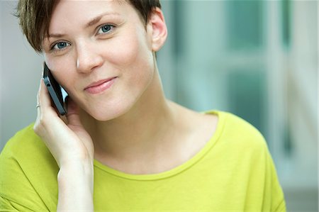 Young woman on mobile phone Stock Photo - Premium Royalty-Free, Code: 649-07238887