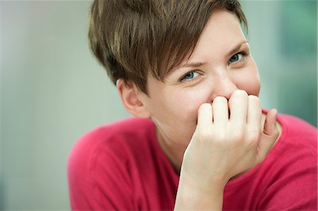 smiling young woman close up - Portrait of young woman Stock Photo - Premium Royalty-Free, Code: 649-07238882