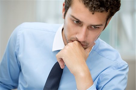 people focus - Young man in deep thought Stock Photo - Premium Royalty-Free, Code: 649-07238900