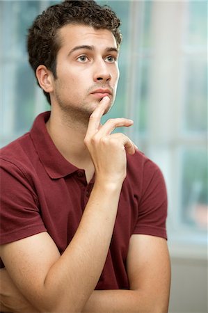 Young man daydreaming Photographie de stock - Premium Libres de Droits, Code: 649-07238910