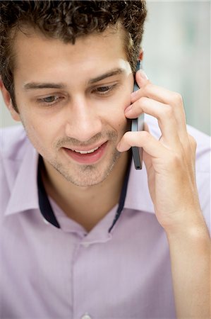 shirt closeup - Young man on mobile phone Stock Photo - Premium Royalty-Free, Code: 649-07238920