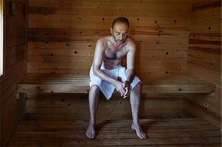 sauna relax - Mature man relaxing in sauna with head down Stock Photo - Premium Royalty-Free, Code: 649-07238962