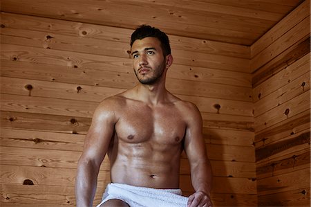 sauna - Young muscular man sitting in sauna Fotografie stock - Premium Royalty-Free, Codice: 649-07238970