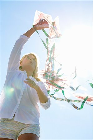 Young woman holding kite, Utvalnas, Gavle, Sweden Stock Photo - Premium Royalty-Free, Code: 649-07239004