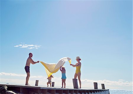 fun toddler - Young family having fun on pier, Utvalnas, Gavle, Sweden Stock Photo - Premium Royalty-Free, Code: 649-07239012