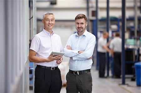 Portrait of two engineers in engineering factory Stock Photo - Premium Royalty-Free, Code: 649-07239357