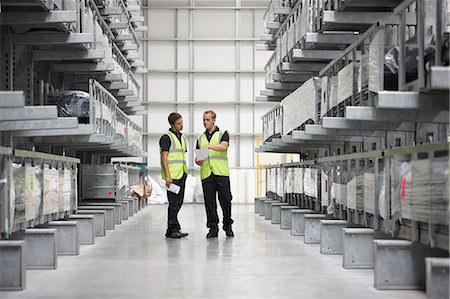 simsearch:649-07239387,k - Warehouse workers in engineering warehouse Stock Photo - Premium Royalty-Free, Code: 649-07239381