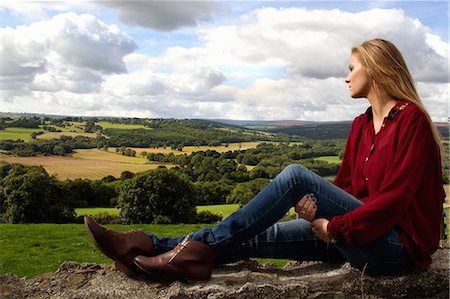 Portrait of young woman looking over rural landscape Stock Photo - Premium Royalty-Free, Code: 649-07239397