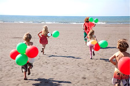 europe beach people photo - Mother with four childen on beach with balloons, Wales, UK Stock Photo - Premium Royalty-Free, Code: 649-07239467