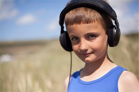 fringe - Portrait of boy wearing headphones, Wales, UK Stock Photo - Premium Royalty-Free, Code: 649-07239479