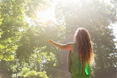 Teenage girl wearing green top with arms out, Prague, Czech Republic Stock Photo - Premium Royalty-Free, Code: 649-07239627