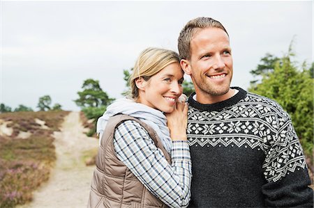 Mid adult couple looking away, smiling Stock Photo - Premium Royalty-Free, Code: 649-07239769