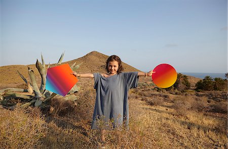 smart - Girl holding bright shapes in desert, Cabo de Gata, Almeria, Spain Stock Photo - Premium Royalty-Free, Code: 649-07239814