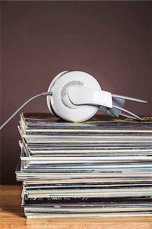 Stack of vinyl records with headphones Stock Photo - Premium Royalty-Free, Code: 649-07279628