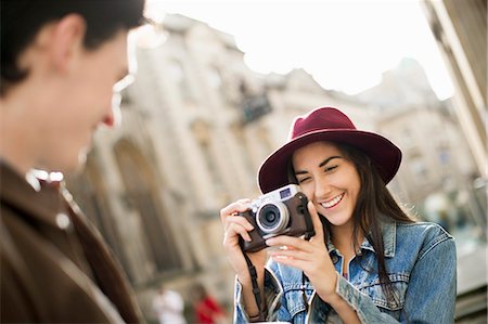 europe city and vacation - Young woman photographing man Stock Photo - Premium Royalty-Free, Code: 649-07279663