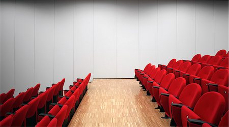 simsearch:632-05991328,k - Red chairs in empty auditorium Photographie de stock - Premium Libres de Droits, Code: 649-07279685