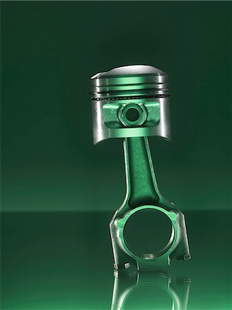 Car piston on green background Stock Photo - Premium Royalty-Free, Code: 649-07279864