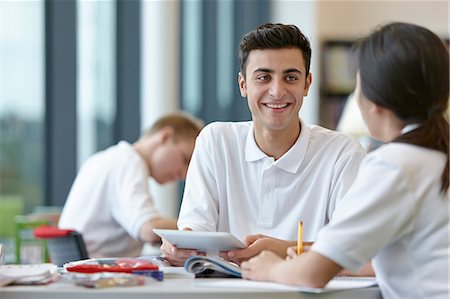 Teenagers working together in school classroom Fotografie stock - Premium Royalty-Free, Codice: 649-07280077