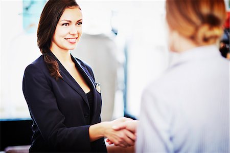 Businesswomen shaking hands Stock Photo - Premium Royalty-Free, Code: 649-07280192