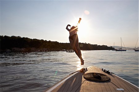 french riviera travel - Woman diving from boat, Cannes Islands, Cote D'Azur, France Stock Photo - Premium Royalty-Free, Code: 649-07280251