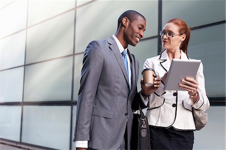 Portrait of businesspeople using digital tablet Foto de stock - Sin royalties Premium, Código: 649-07280628